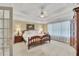 Serene main bedroom with a tray ceiling, soft lighting, and a view of the bathroom at 6302 Manassas Nw Pass, Acworth, GA 30101