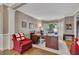 Inviting home office space with hardwood floors, large desk, and great natural light from shuttered windows at 6302 Manassas Nw Pass, Acworth, GA 30101