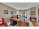 Home office with a large wooden desk, bay windows with shutters, and hardwood floors at 6302 Manassas Nw Pass, Acworth, GA 30101