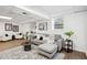 Finished basement with plush seating, light-colored wood floors, and neutral color palette at 1606 Van Epps Se St, Atlanta, GA 30316