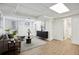 Finished basement with stylish decor, laminate floors, and access to another room at 1606 Van Epps Se St, Atlanta, GA 30316