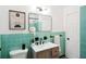 Bathroom featuring bright blue tile, sleek fixtures, and a modern aesthetic at 1606 Van Epps Se St, Atlanta, GA 30316