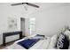 Bright bedroom featuring a ceiling fan, wood floors, and stylish decor at 1606 Van Epps Se St, Atlanta, GA 30316