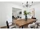 Open dining room adjacent to living area, features a modern light fixture and table at 1606 Van Epps Se St, Atlanta, GA 30316