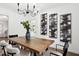 Dining area with wood table, chandelier, and modern wall art at 1606 Van Epps Se St, Atlanta, GA 30316