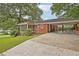 Charming brick home featuring a spacious driveway and carport providing ample parking space at 1606 Van Epps Se St, Atlanta, GA 30316