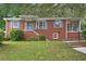 Charming brick home with blue shutters and a well-maintained lawn at 1606 Van Epps Se St, Atlanta, GA 30316
