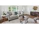 Cozy living room with neutral tones, stylish furniture, and ample natural light at 1606 Van Epps Se St, Atlanta, GA 30316