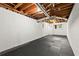 Spacious basement with painted walls and a small window, providing a blank canvas for future renovations and expansion at 2060 Candlewood Ne Ct, Marietta, GA 30066