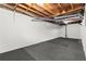 Unfinished basement featuring open joist ceilings and painted walls, offering potential for customization and additional living space at 2060 Candlewood Ne Ct, Marietta, GA 30066