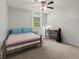 Serene bedroom featuring a ceiling fan, light wood desk and a light-filled window, creating a relaxing space at 2060 Candlewood Ne Ct, Marietta, GA 30066