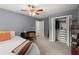 Comfortable bedroom with closet, ceiling fan, a desk, and soft carpeting, ideal for relaxation and study at 2060 Candlewood Ne Ct, Marietta, GA 30066
