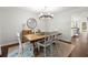 Elegant dining room with wood table, seating for six, and access to kitchen at 2060 Candlewood Ne Ct, Marietta, GA 30066