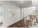 Bright foyer with hardwood floors, decorative front door, and a view of the dining area at 2060 Candlewood Ne Ct, Marietta, GA 30066