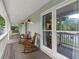 Relaxing front porch with rocking chairs and decorative lanterns, perfect for enjoying the outdoors at 2060 Candlewood Ne Ct, Marietta, GA 30066