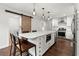 Modern kitchen with a central island, stainless steel appliances, and a sliding barn door at 2060 Candlewood Ne Ct, Marietta, GA 30066