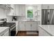 Stylish kitchen with white cabinets, stainless steel appliances, and granite countertops at 2060 Candlewood Ne Ct, Marietta, GA 30066