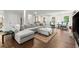 Spacious living room with hardwood floors, ample seating, and plenty of natural light at 2060 Candlewood Ne Ct, Marietta, GA 30066
