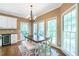 Breakfast nook with large windows, a table, and a bench on a colorful rug at 5396 Turnbill Nw Pt, Acworth, GA 30101