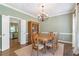 Dining room with chandelier, area rug, and stylish chairs at 5396 Turnbill Nw Pt, Acworth, GA 30101