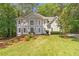 Charming two-story traditional home with a manicured lawn and gray painted brick exterior at 5396 Turnbill Nw Pt, Acworth, GA 30101