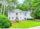 Charming two-story home with a manicured lawn and mature landscaping at 5396 Turnbill Nw Pt, Acworth, GA 30101