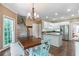 Eat-in kitchen with white cabinets, stainless steel appliances, and hardwood floors at 5396 Turnbill Nw Pt, Acworth, GA 30101