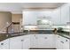 Updated kitchen with granite countertops, subway tile backsplash, and stainless steel appliances at 5396 Turnbill Nw Pt, Acworth, GA 30101