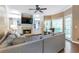 Comfortable living room with fireplace, built-ins, and access to the outdoor deck at 5396 Turnbill Nw Pt, Acworth, GA 30101