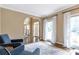 Open-concept living room with bright windows and hardwood floors at 5396 Turnbill Nw Pt, Acworth, GA 30101