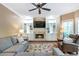 Cozy living room featuring custom built-ins, a fireplace, and lots of comfortable seating at 5396 Turnbill Nw Pt, Acworth, GA 30101