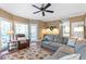 Bright and airy living room with large windows and an adjacent deck, perfect for entertaining at 5396 Turnbill Nw Pt, Acworth, GA 30101