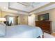 Main bedroom with desk area, carpeted floors, and a tray ceiling at 5396 Turnbill Nw Pt, Acworth, GA 30101
