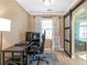 This spacious home office offers a sliding door to the bathroom and a comfortable workspace at 5396 Turnbill Nw Pt, Acworth, GA 30101