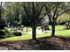 Community playground with swings, slides, and climbing structures on a grassy lawn at 5396 Turnbill Nw Pt, Acworth, GA 30101