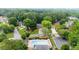 Community aerial view featuring a pool, houses, and lush greenery in a suburban neighborhood at 10865 Misty Moon Ct, Alpharetta, GA 30022
