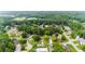Wide aerial shot of a suburban neighborhood showcasing homes with mature trees and landscaping at 10865 Misty Moon Ct, Alpharetta, GA 30022
