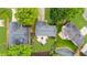 Bird's-eye view of the property featuring a backyard patio, lawn, and neighboring homes at 10865 Misty Moon Ct, Alpharetta, GA 30022