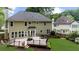 Well-maintained backyard with a large deck, lawn, and view of surrounding homes at 10865 Misty Moon Ct, Alpharetta, GA 30022