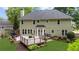 View of backyard featuring a wooden deck with railings and well-maintained landscaping at 10865 Misty Moon Ct, Alpharetta, GA 30022