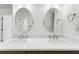 Bright bathroom features dual sinks with modern fixtures and bright white cabinets at 10865 Misty Moon Ct, Alpharetta, GA 30022