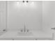 This bright bathroom features a modern vanity with a quartz countertop and updated faucet at 10865 Misty Moon Ct, Alpharetta, GA 30022
