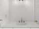 This bright bathroom features a modern vanity with a quartz countertop and updated faucet at 10865 Misty Moon Ct, Alpharetta, GA 30022