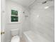 Elegant bathroom with a tiled shower over tub and modern fixtures for a luxurious experience at 10865 Misty Moon Ct, Alpharetta, GA 30022