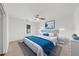 Bright bedroom with a ceiling fan, soft carpet and an upholstered headboard at 10865 Misty Moon Ct, Alpharetta, GA 30022