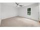 Bright bedroom with a modern ceiling fan and large window, providing natural light at 10865 Misty Moon Ct, Alpharetta, GA 30022