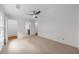 A spacious, carpeted bedroom with a modern ceiling fan and white walls at 10865 Misty Moon Ct, Alpharetta, GA 30022