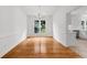 Bright dining room featuring wood floors, white walls, and a chandelier at 10865 Misty Moon Ct, Alpharetta, GA 30022