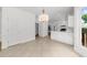 Spacious kitchen includes white cabinets and view into sunroom and kitchen area at 10865 Misty Moon Ct, Alpharetta, GA 30022