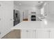 Bright kitchen featuring white cabinets, stainless steel appliances and ample counter space at 10865 Misty Moon Ct, Alpharetta, GA 30022